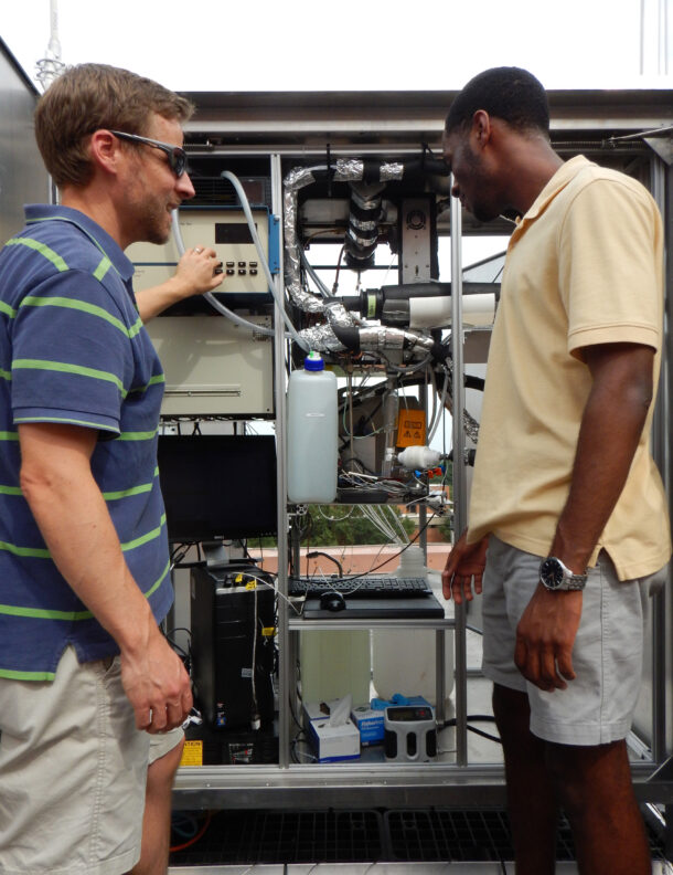 Chris Hennigan (left) and Travis McKay (right) prepare to make air pollution measurements in Baltimore